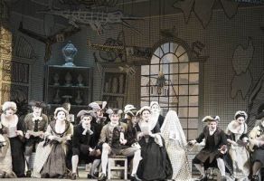 The ensemble in grisaille costumes